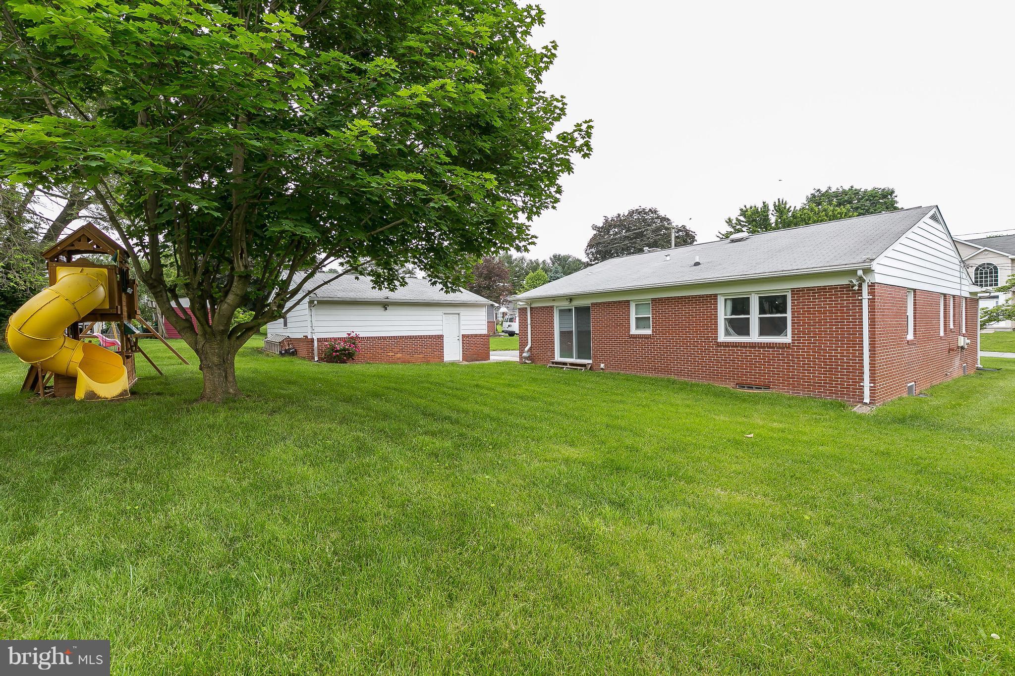 10 Harding Street Lutherville-Timonium, MD 21093 - Photo 4 of 30 a view of a yard in front of a house with large trees