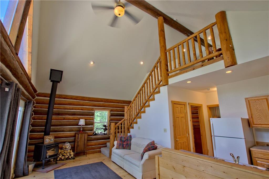 101 Rachaels Place Fairplay, CO 80440 - Photo 20 of 25 a view of staircase with lots of frames on wall and a window