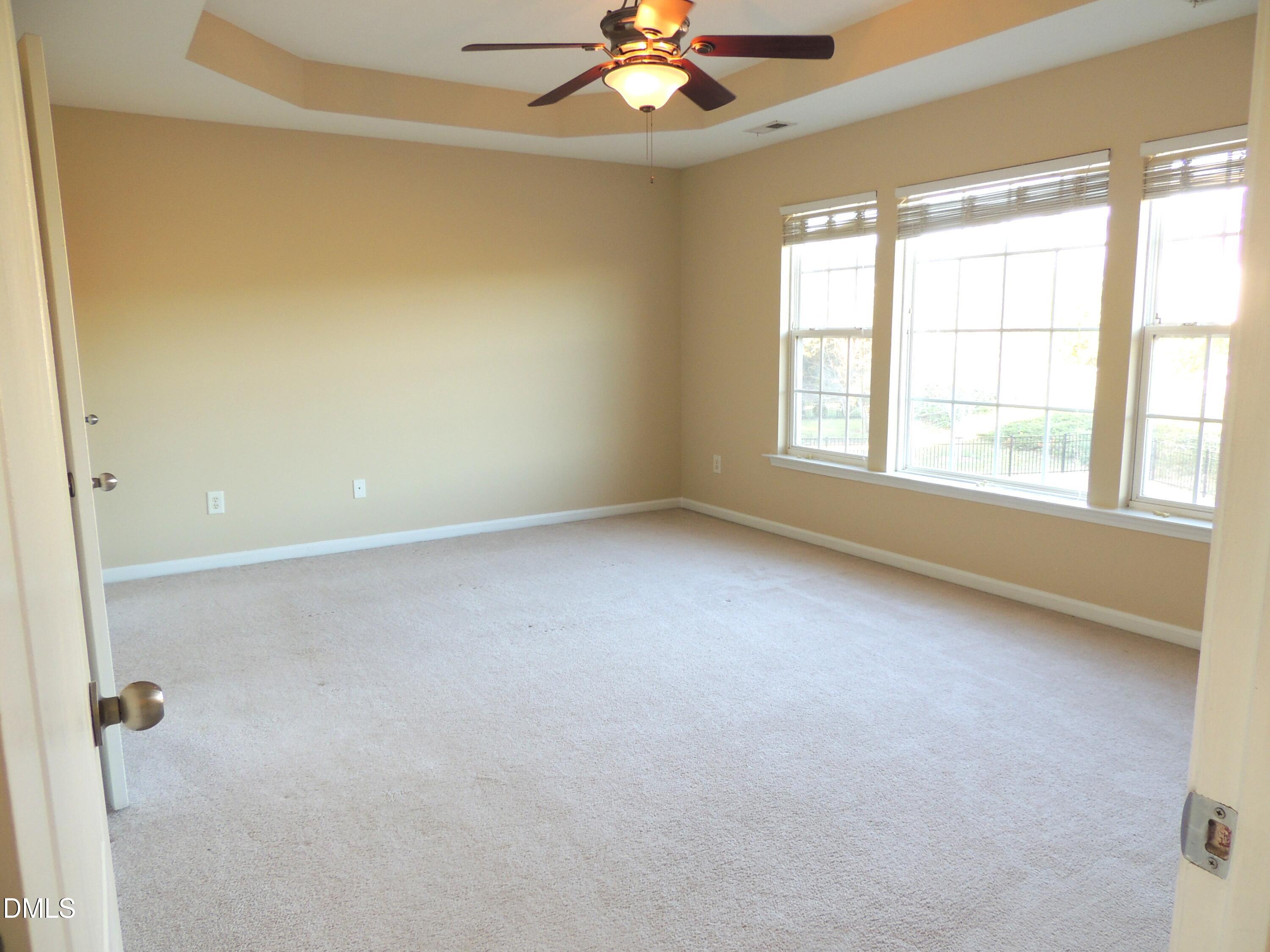 12544 Honeychurch Street Raleigh, NC 27614 - Photo 12 of 24 a view of an empty room with a window