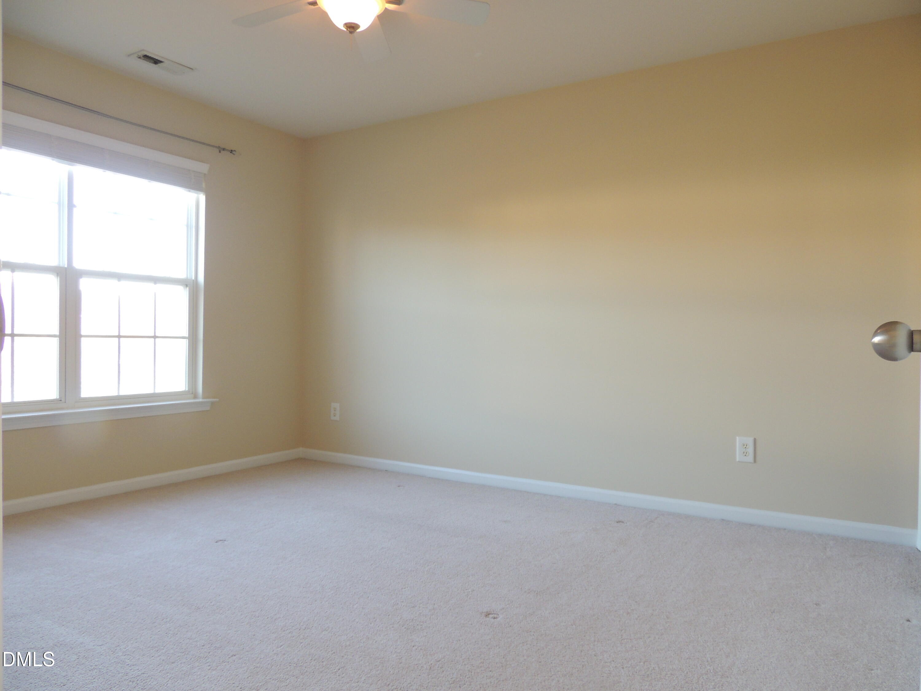12544 Honeychurch Street Raleigh, NC 27614 - Photo 15 of 24 an empty room with a window