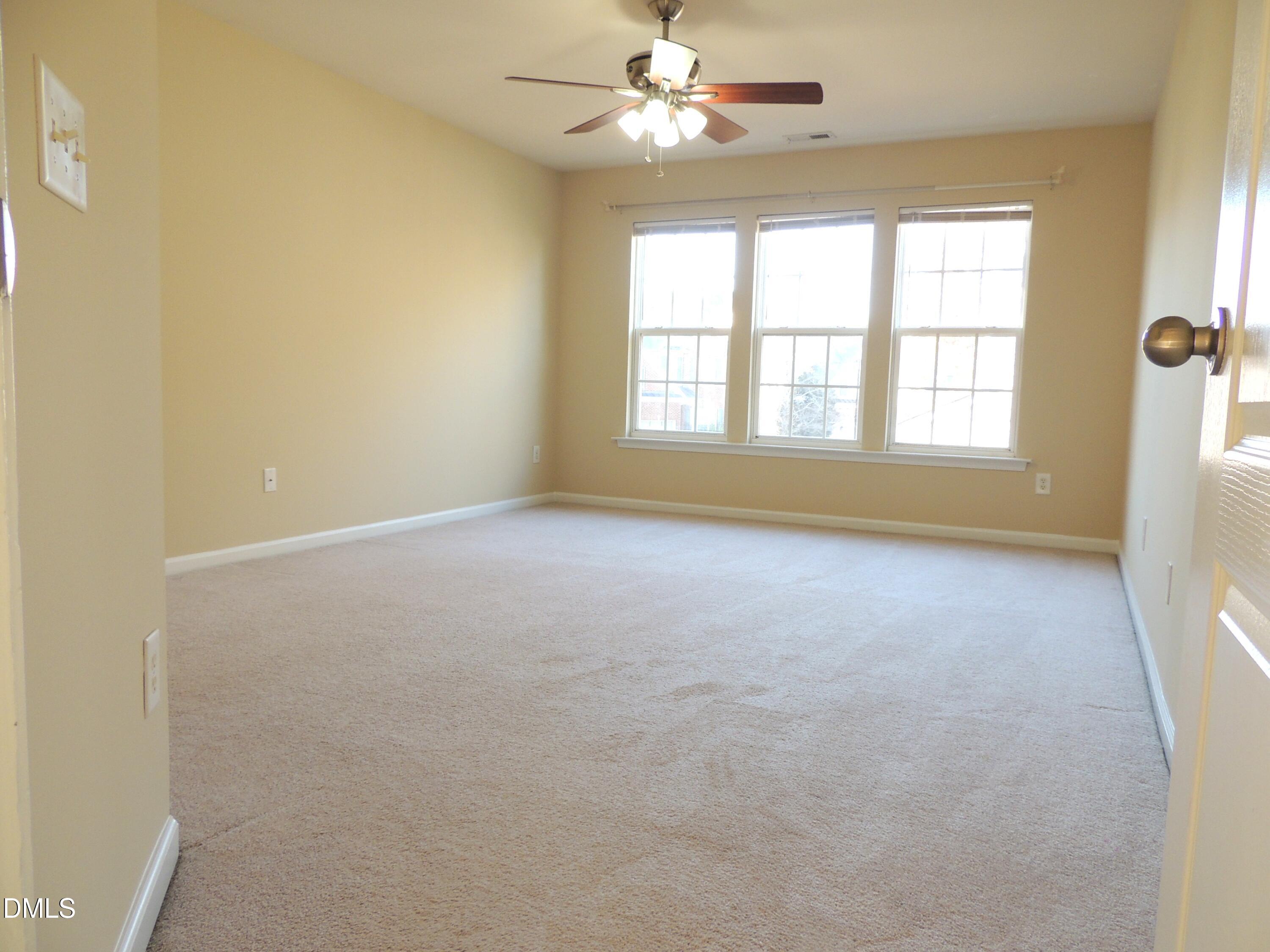 12544 Honeychurch Street Raleigh, NC 27614 - Photo 17 of 24 a view of an empty room with a window