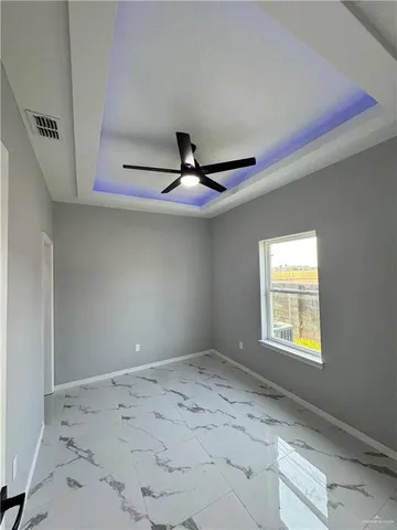 a view of a hallway with a window