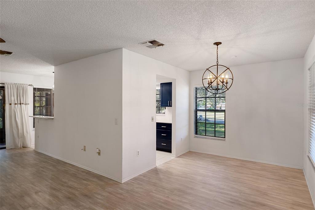 2129 Point O Woods Court Spring Hill, FL 34606 - Photo 12 of 76 a view of empty room with wooden floor and window