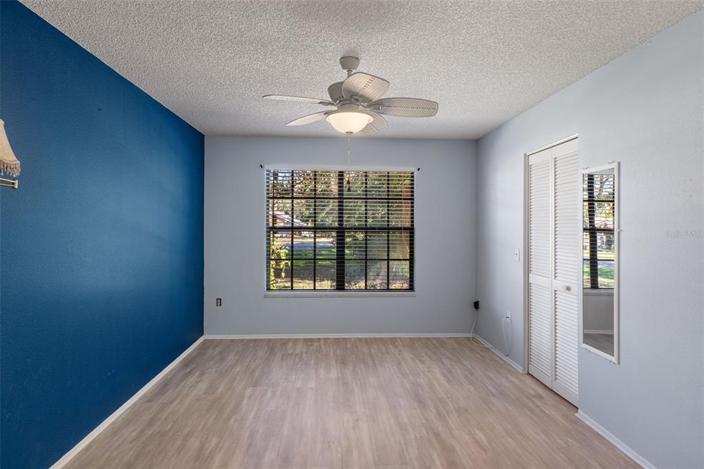 2129 Point O Woods Court Spring Hill, FL 34606 - Photo 19 of 76 a view of an empty room with a window