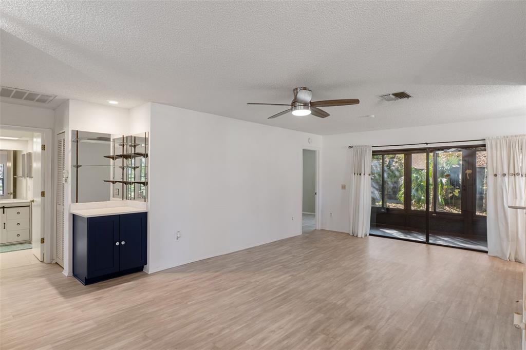 2129 Point O Woods Court Spring Hill, FL 34606 - Photo 7 of 76 a view of an empty room with a window