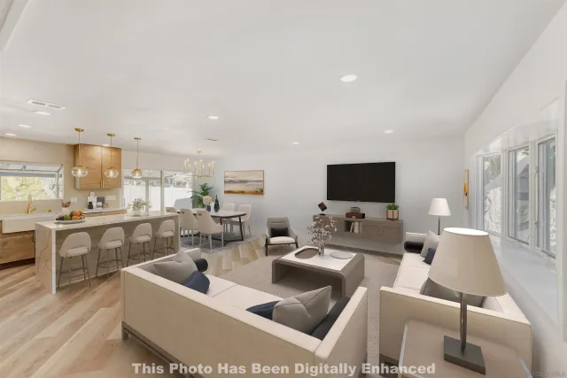 a large kitchen with a table and chairs