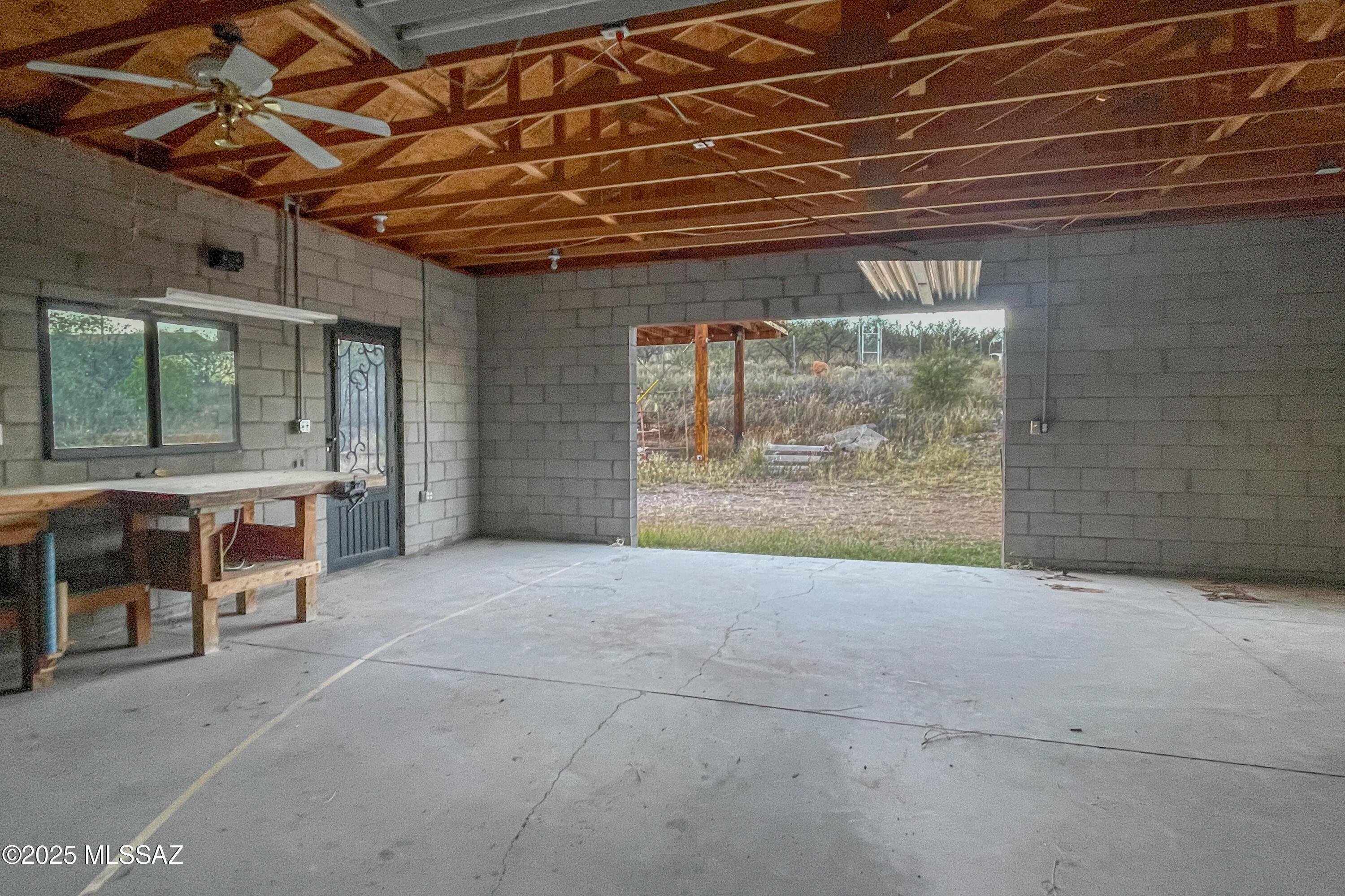 480 Camino Ramanote Rio Rico, AZ 85648 - Photo 39 of 43 Inside spacious workshop to north wall, opening for door