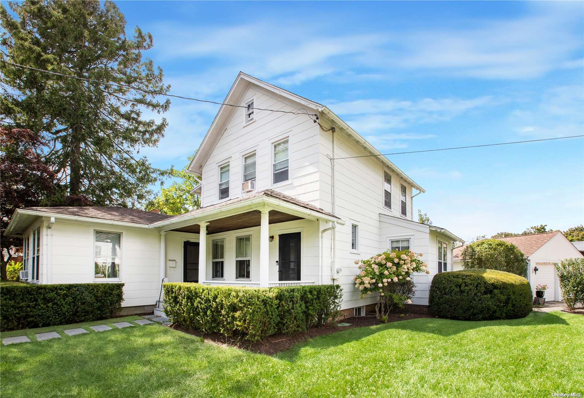 165 South Country Road Bellport, NY 11713 - Photo 1 of 1 a view of a house with a yard