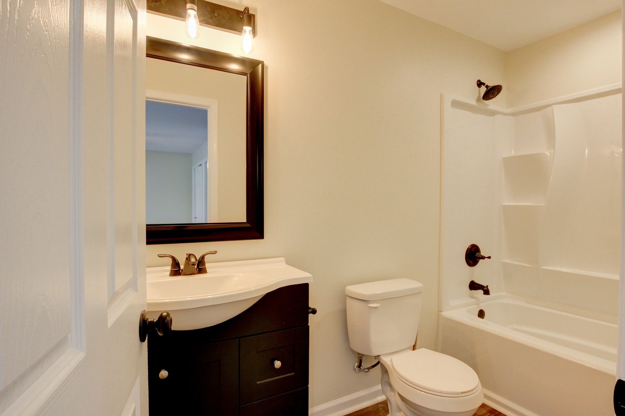 825 Pollard Road Clarksville, TN 37042 - Photo 16 of 44 a bathroom with a sink a toilet and shower
