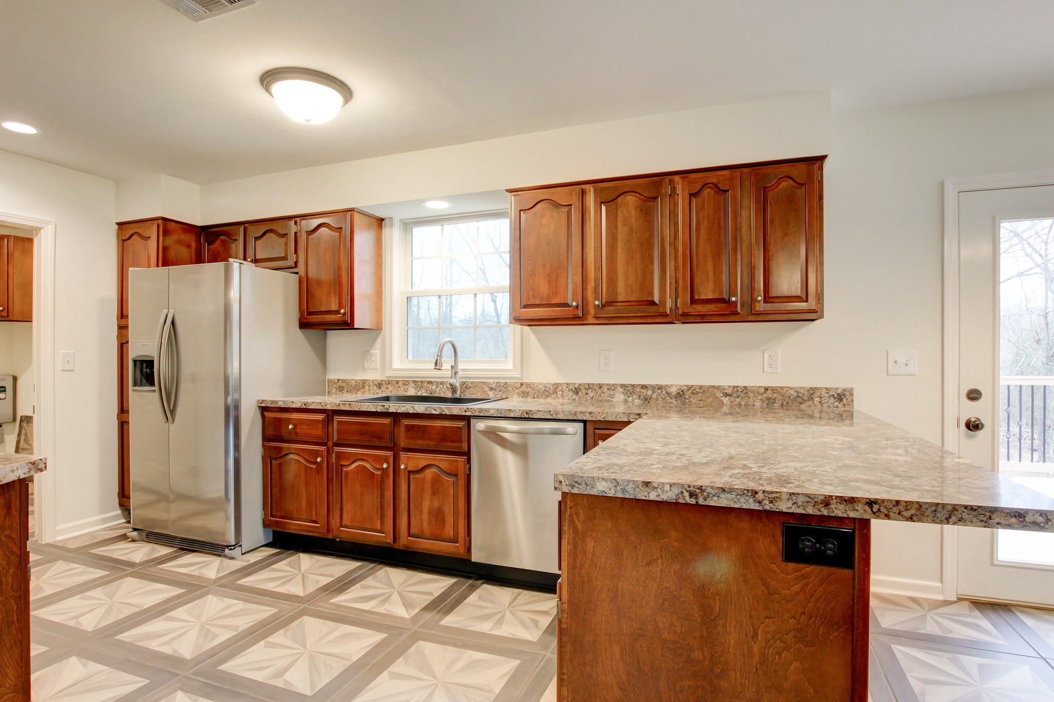 825 Pollard Road Clarksville, TN 37042 - Photo 23 of 44 a kitchen with stainless steel appliances granite countertop a sink stove and refrigerator