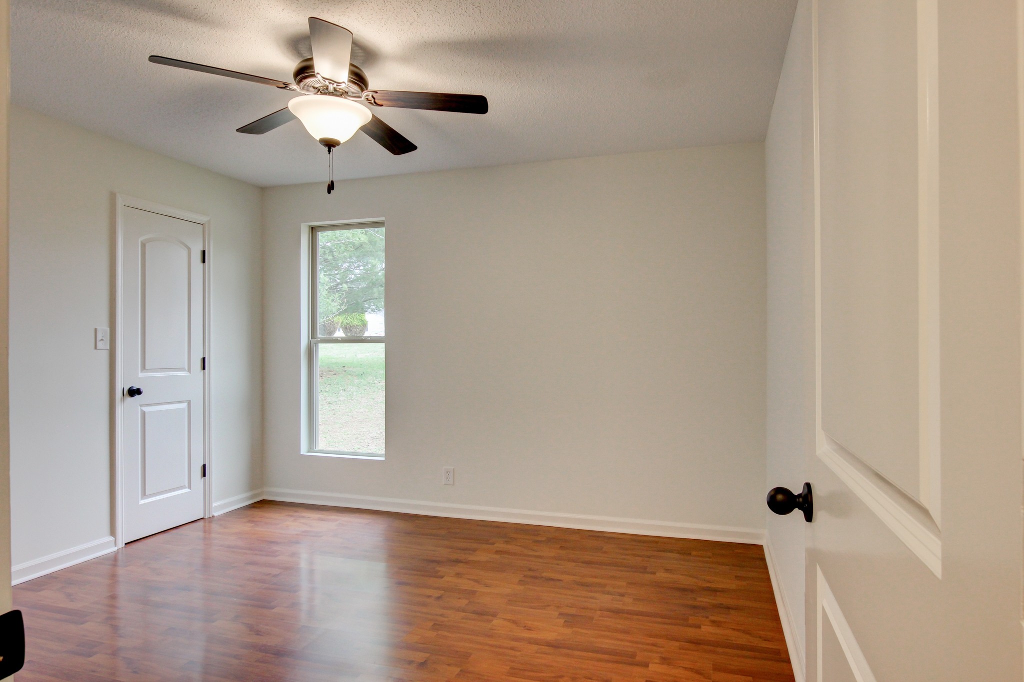 825 Pollard Road Clarksville, TN 37042 - Photo 32 of 44 wooden floor in an empty room with a window
