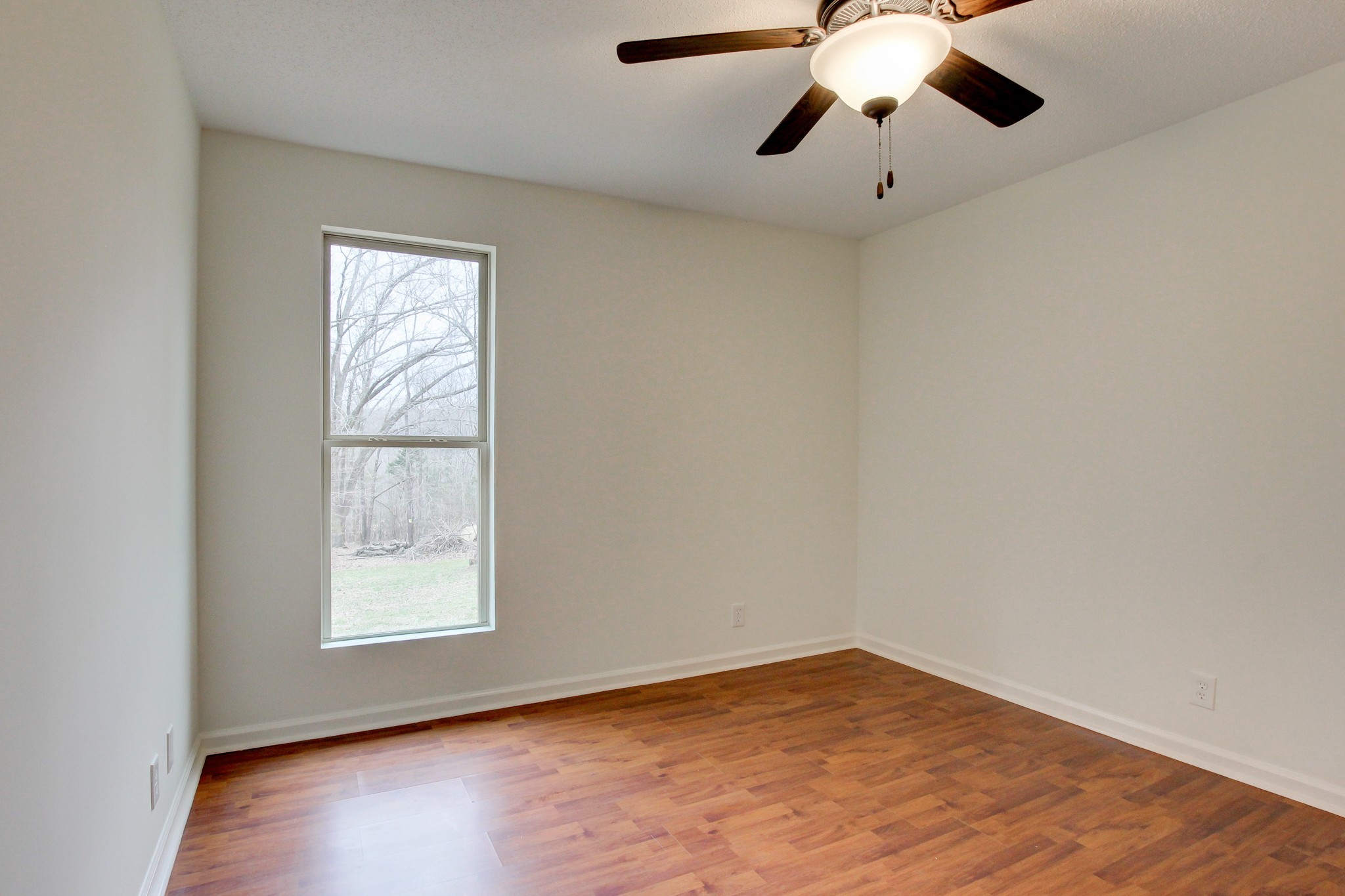 825 Pollard Road Clarksville, TN 37042 - Photo 36 of 44 a view of an empty room with wooden floor and a window