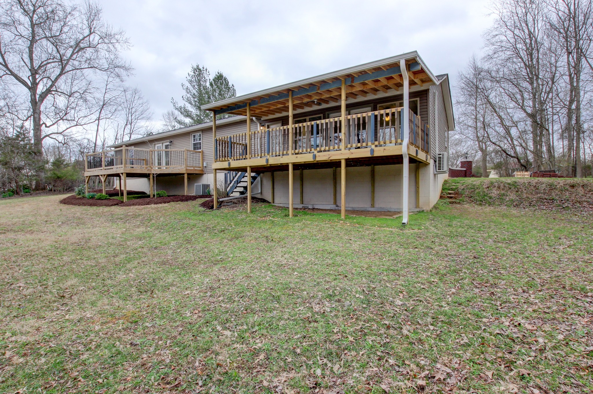 825 Pollard Road Clarksville, TN 37042 - Photo 44 of 44 a view of a house with a yard and large trees