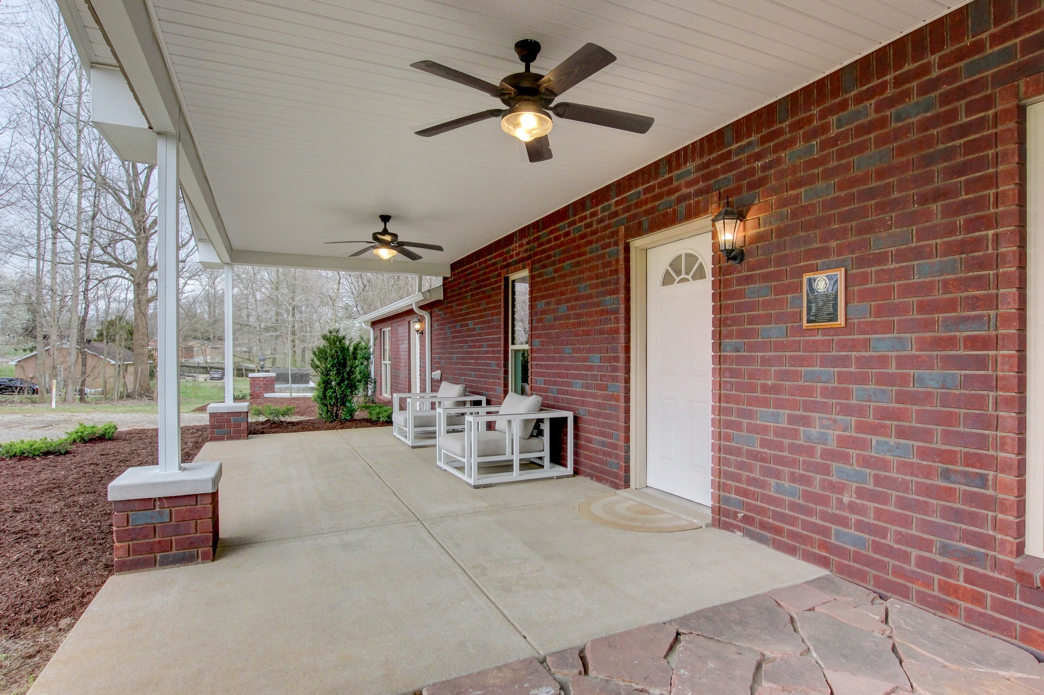 825 Pollard Road Clarksville, TN 37042 - Photo 5 of 44 a view of a patio with a table and chairs and a barbeque