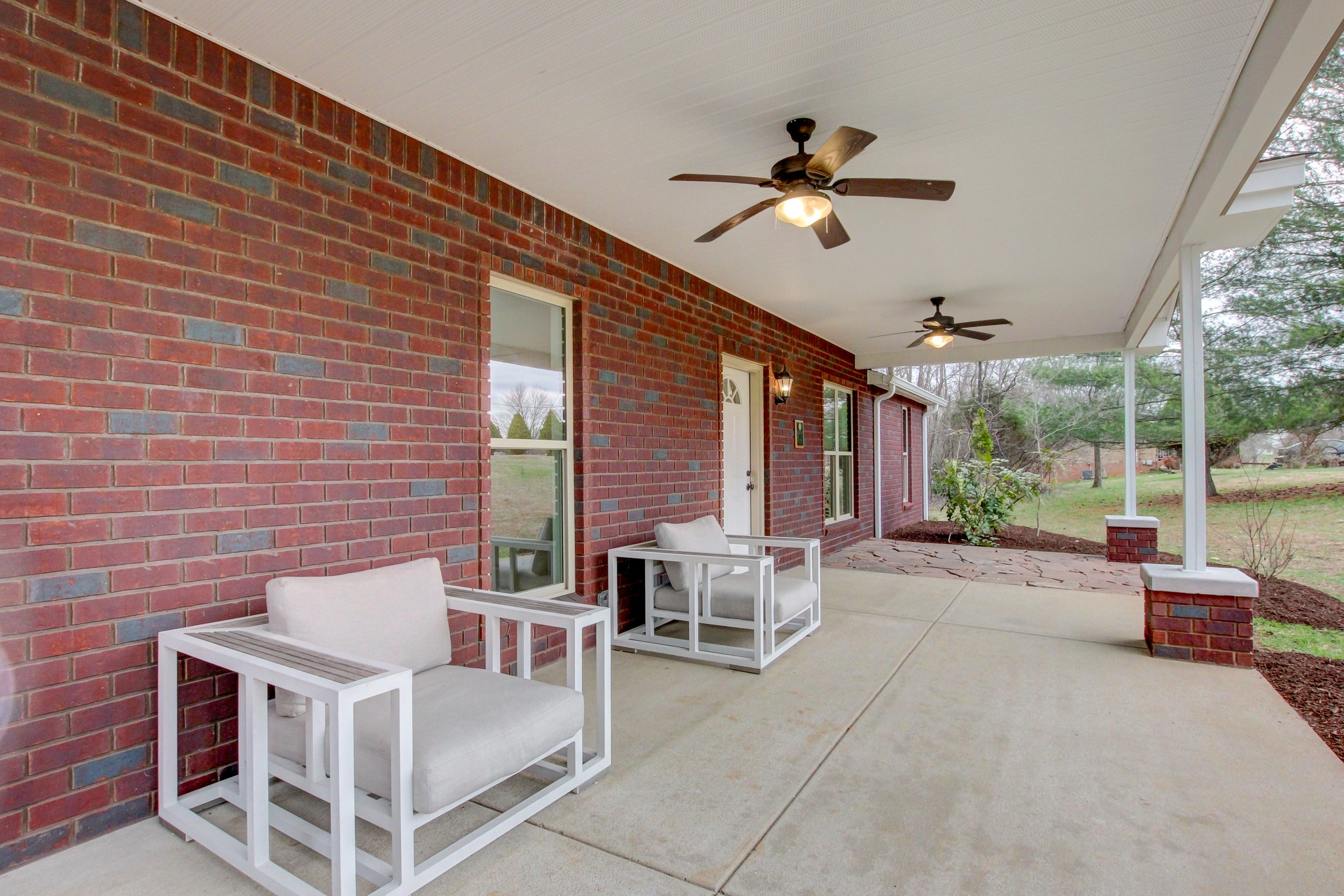 825 Pollard Road Clarksville, TN 37042 - Photo 6 of 44 a view of a patio with a table and chairs