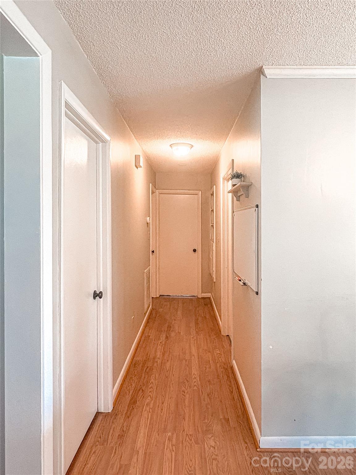 2011 Mountain Creek Road Albemarle, NC 28001 - Photo 15 of 27 a view of a hallway with wooden floor