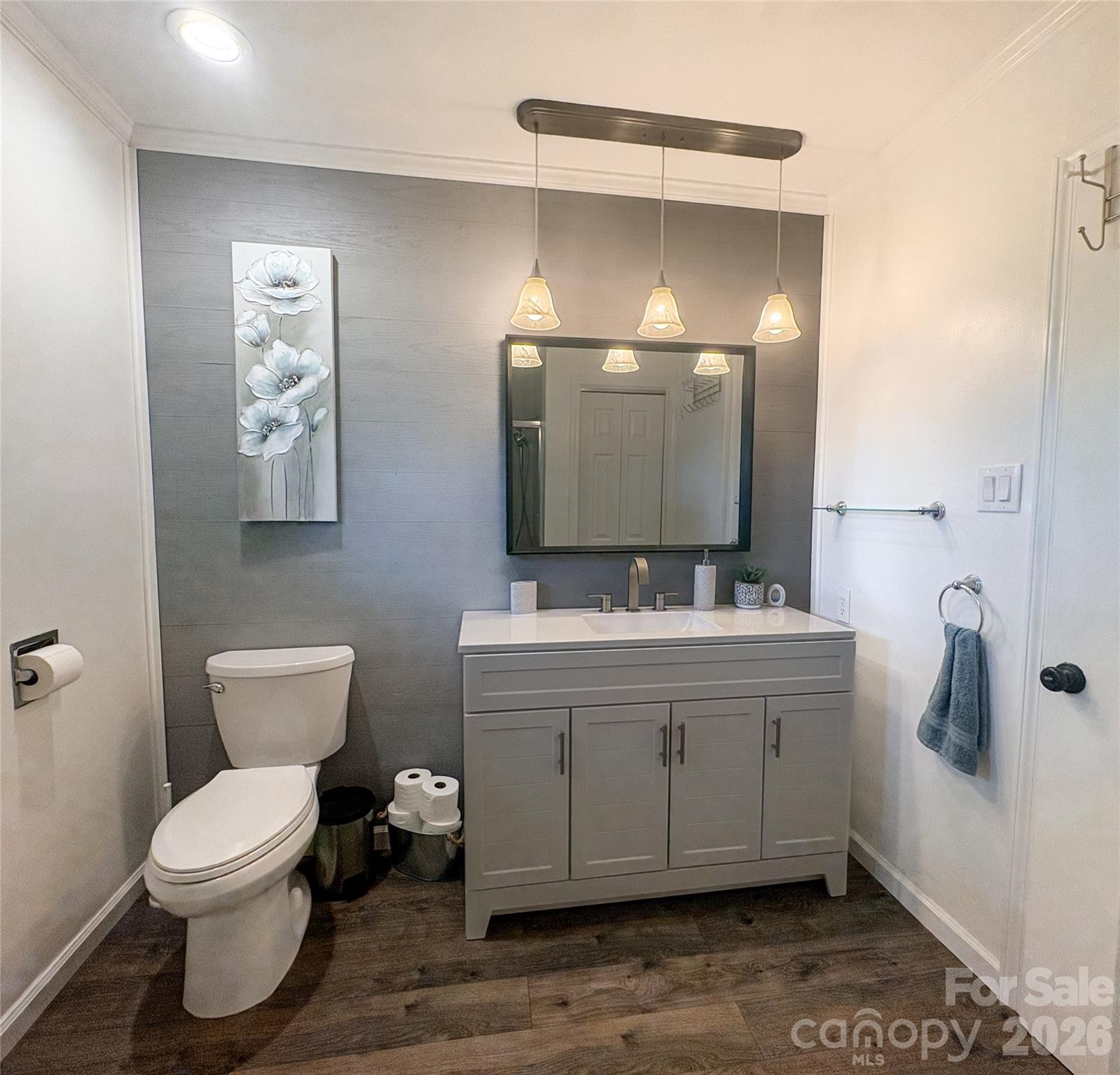 2011 Mountain Creek Road Albemarle, NC 28001 - Photo 16 of 27 a bathroom with a toilet sink and mirror
