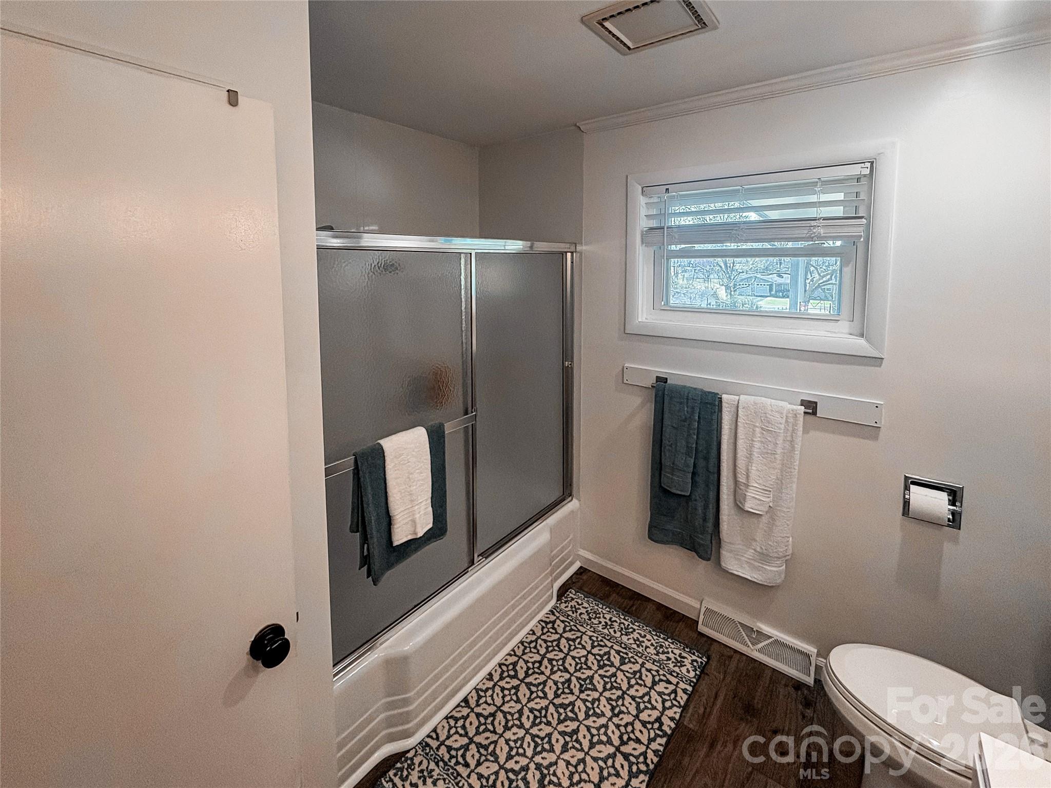 2011 Mountain Creek Road Albemarle, NC 28001 - Photo 17 of 27 a bathroom with a toilet and a shower