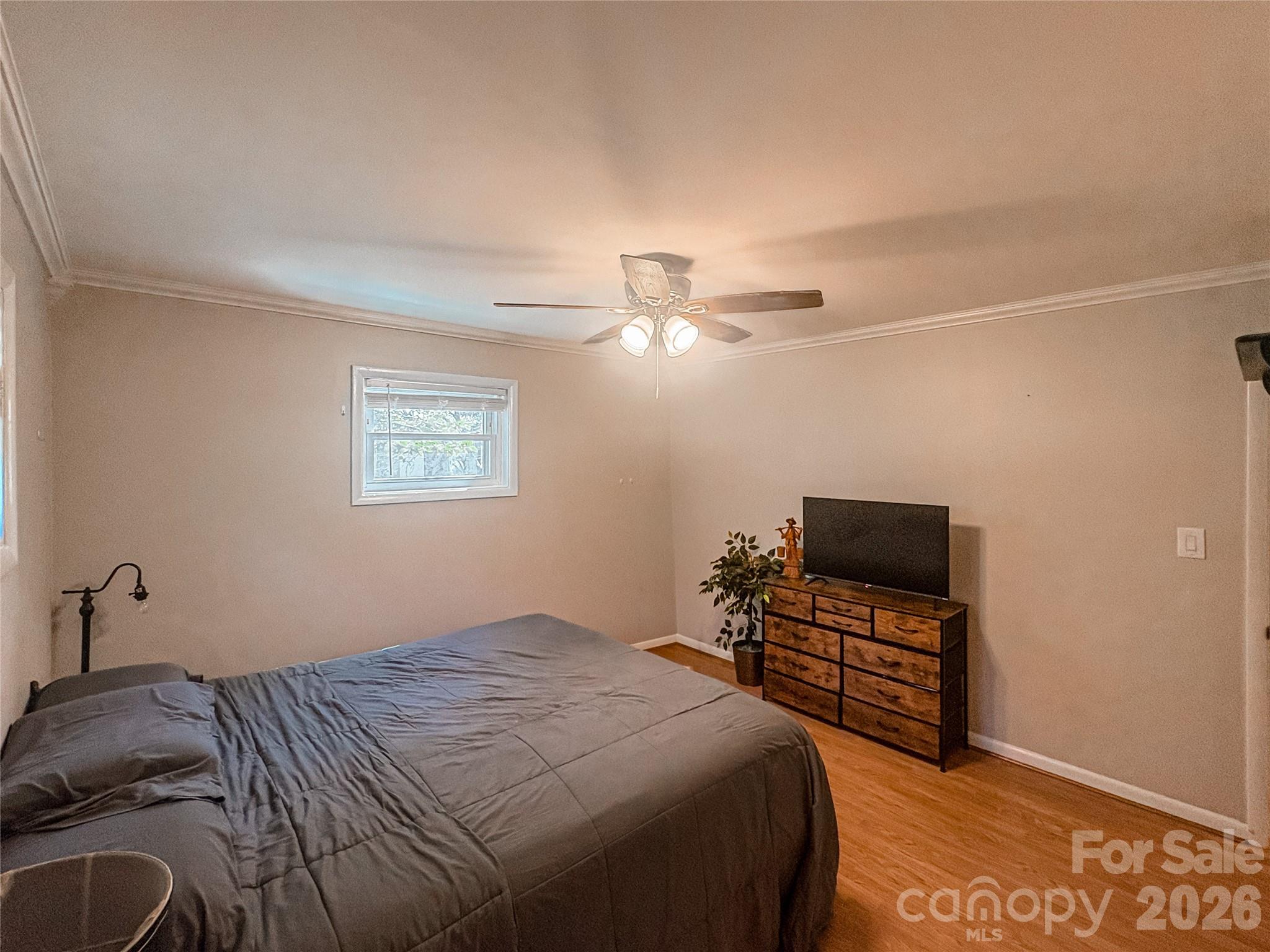 2011 Mountain Creek Road Albemarle, NC 28001 - Photo 21 of 27 a bedroom with a bed and a flat screen tv