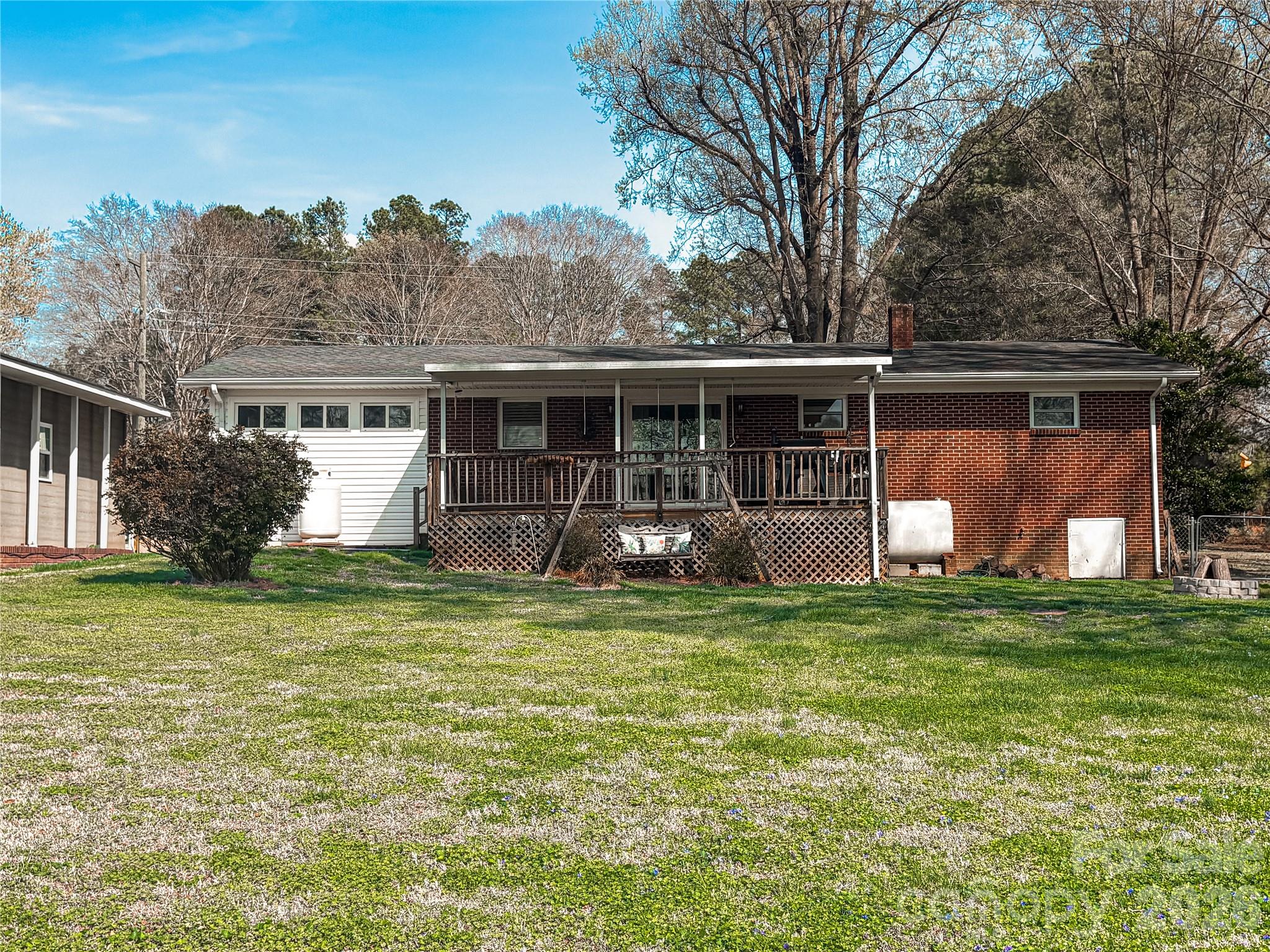 2011 Mountain Creek Road Albemarle, NC 28001 - Photo 22 of 27 a front view of house with yard and green space