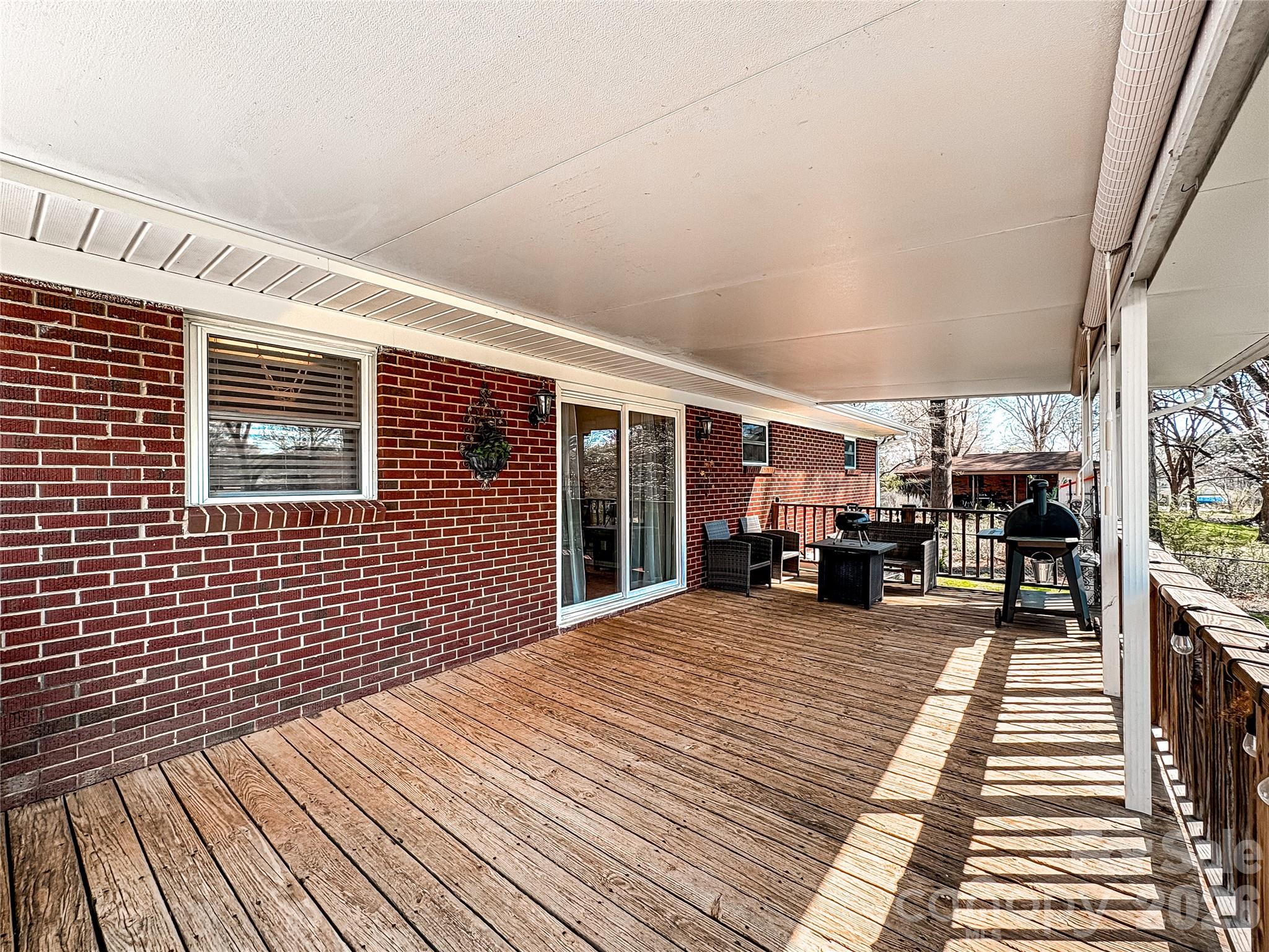 2011 Mountain Creek Road Albemarle, NC 28001 - Photo 24 of 27 a view of a patio with wooden fence