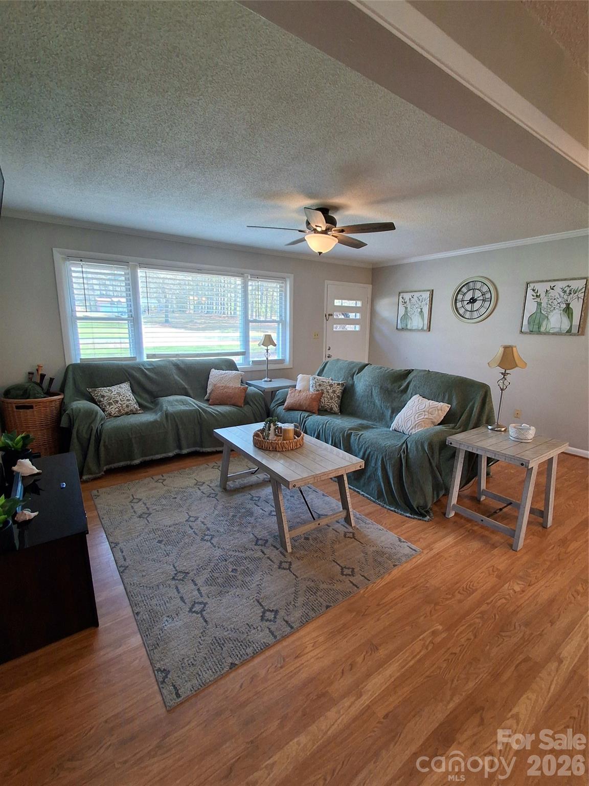 2011 Mountain Creek Road Albemarle, NC 28001 - Photo 7 of 27 a living room with furniture and a large window