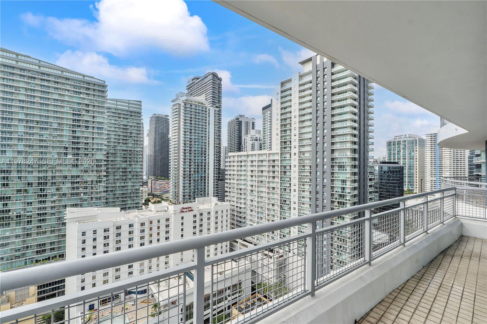 60 Southwest 13th Street, Unit 1921 Miami, FL 33130 - Photo 11 of 23 a view of balcony with wooden floor