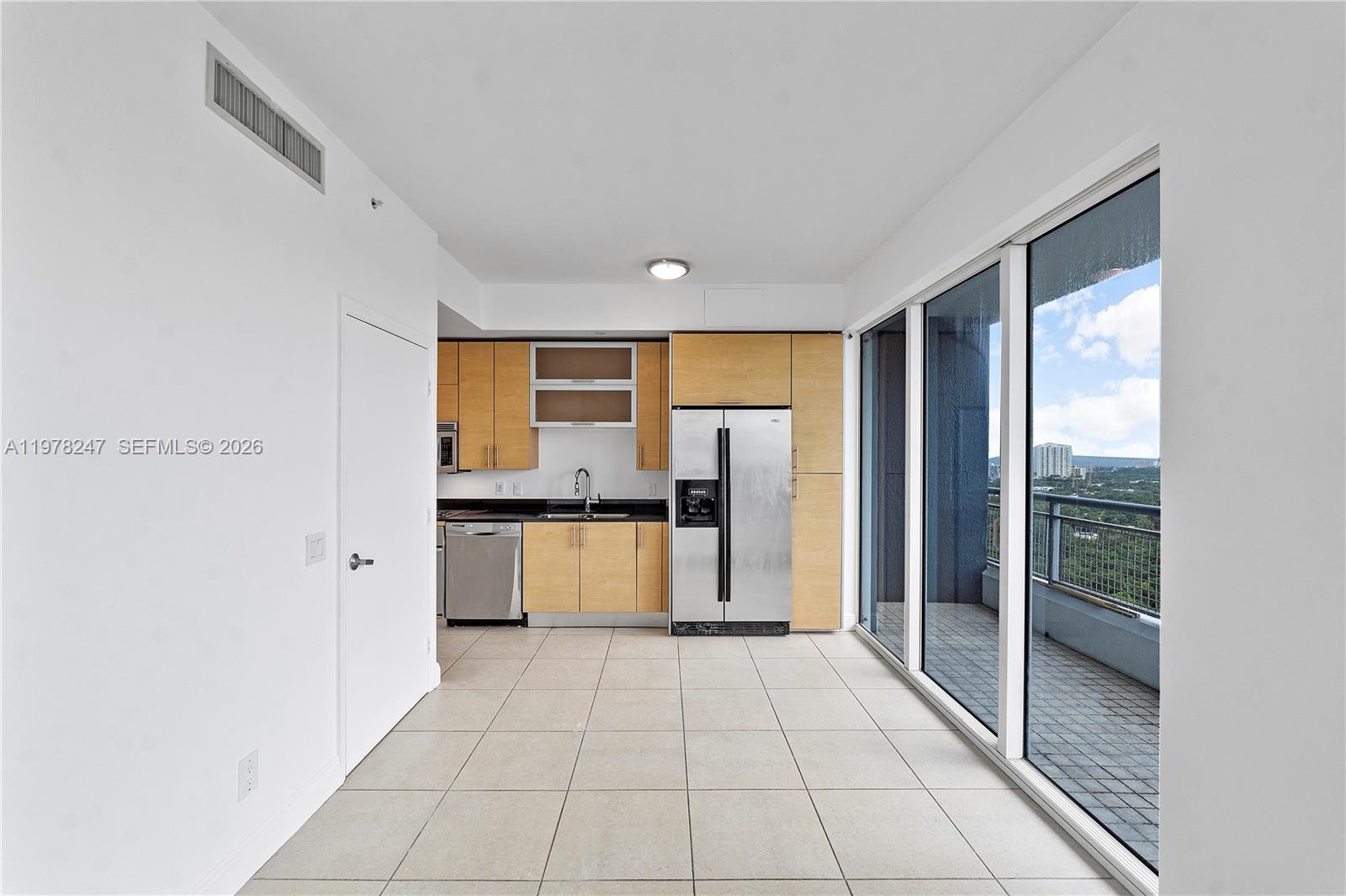 60 Southwest 13th Street, Unit 1921 Miami, FL 33130 - Photo 6 of 23 a view of a kitchen with a sink