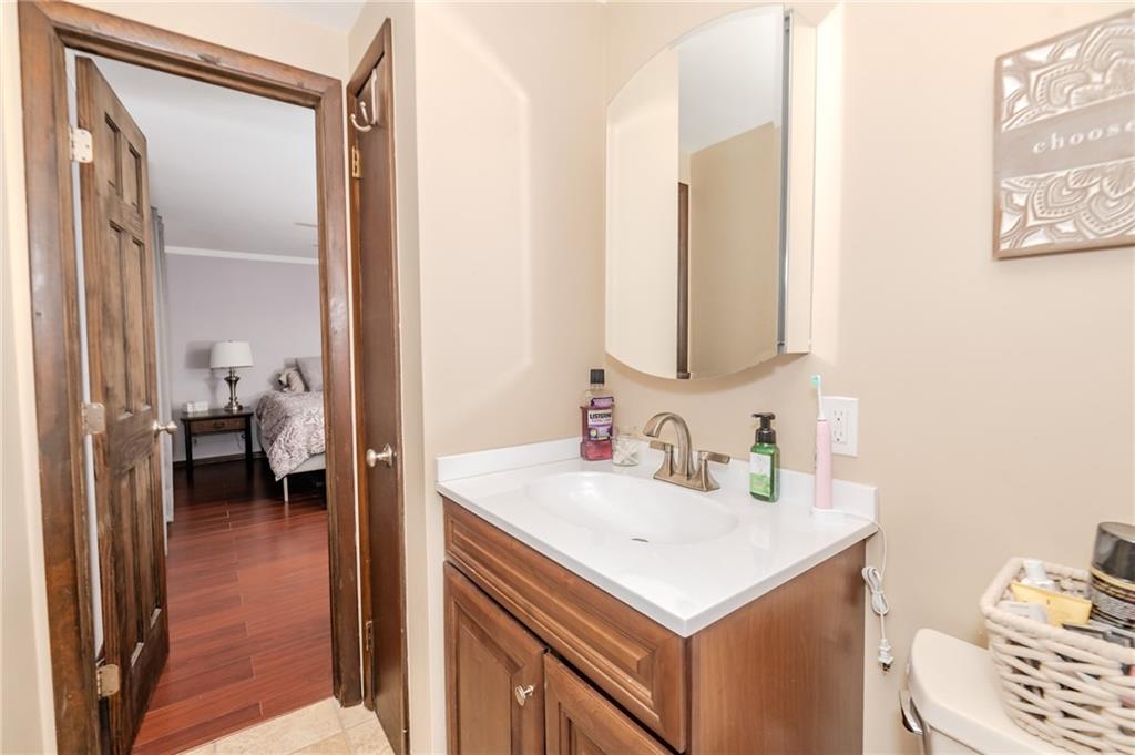 2229 Ramsey Road Monroeville, PA 15146 - Photo 18 of 40 a bathroom with a sink and a mirror