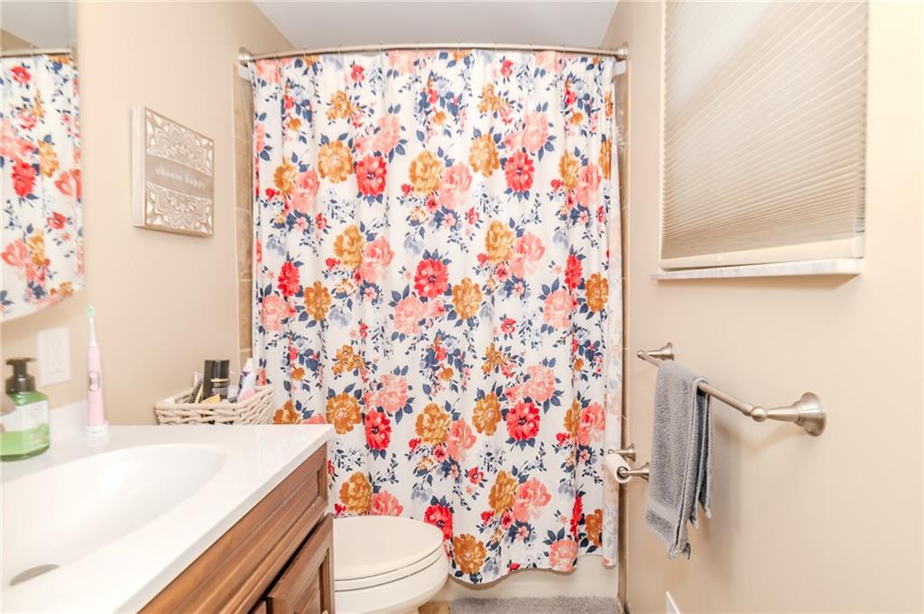 2229 Ramsey Road Monroeville, PA 15146 - Photo 19 of 40 a bathroom with a sink toilet and shower curtain
