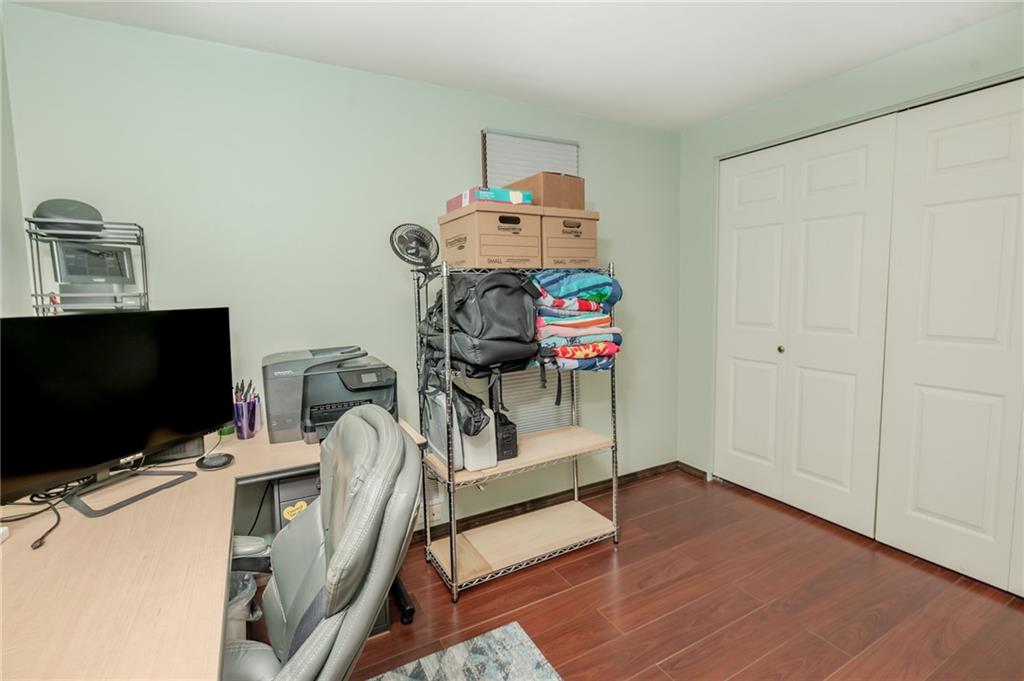 2229 Ramsey Road Monroeville, PA 15146 - Photo 21 of 40 a view of a workspace with furniture and a flat screen tv