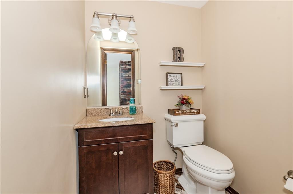 2229 Ramsey Road Monroeville, PA 15146 - Photo 25 of 40 a bathroom with a toilet a sink and mirror