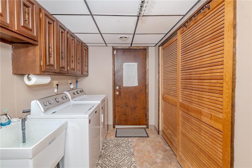 2229 Ramsey Road Monroeville, PA 15146 - Photo 26 of 40 a utility room with a sink a washer and dryer