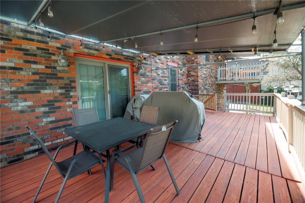 2229 Ramsey Road Monroeville, PA 15146 - Photo 31 of 40 a roof deck with table and chairs and wooden floor