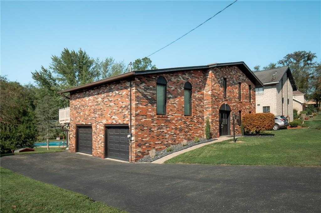 2229 Ramsey Road Monroeville, PA 15146 - Photo 40 of 40 a front view of a house with a garden and yard