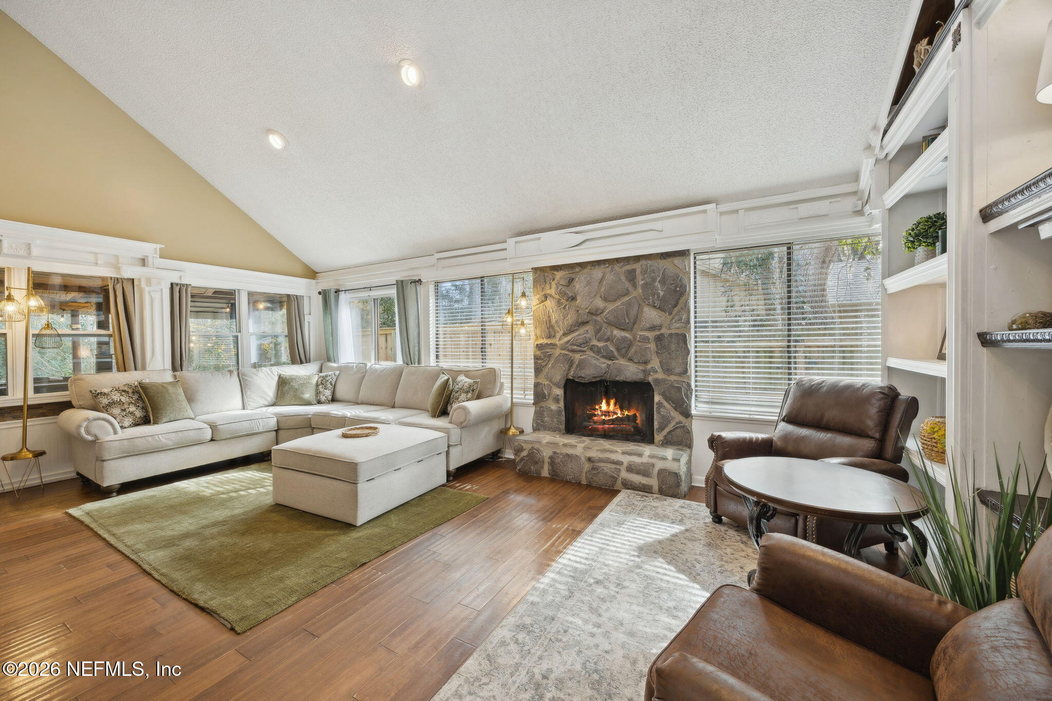 2431 Cypress Springs Road Orange Park, FL 32073 - Photo 22 of 83 a living room with furniture and a fireplace