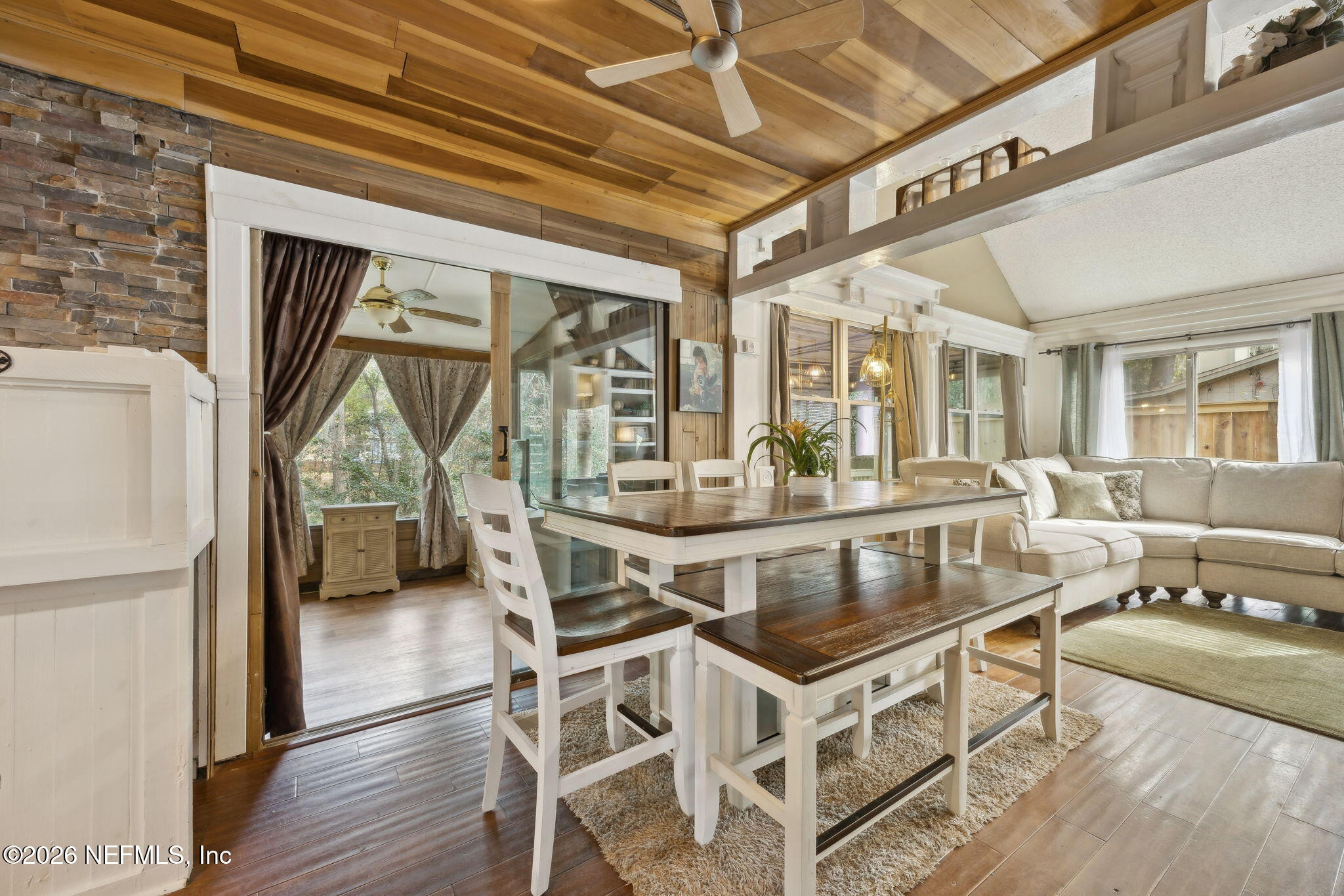 2431 Cypress Springs Road Orange Park, FL 32073 - Photo 28 of 83 a dining room with wooden floor and large windows