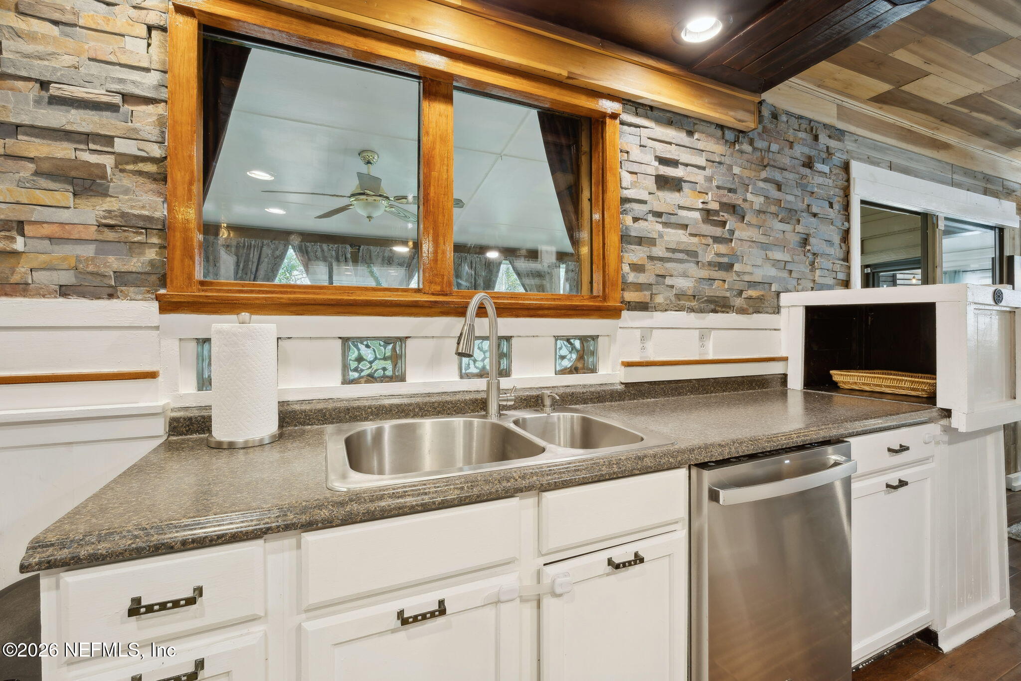 2431 Cypress Springs Road Orange Park, FL 32073 - Photo 33 of 83 a kitchen with granite countertop a sink and a window