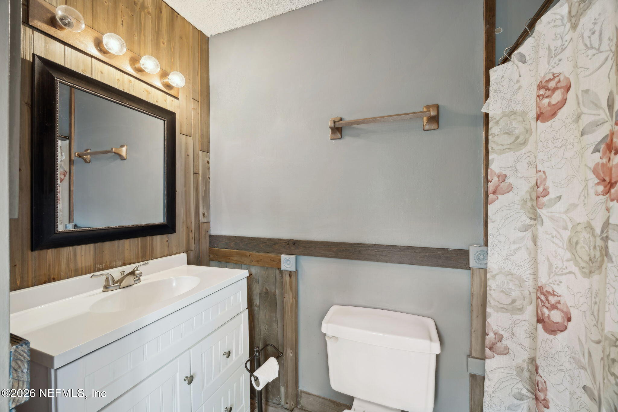 2431 Cypress Springs Road Orange Park, FL 32073 - Photo 43 of 83 a bathroom with a toilet sink and mirror