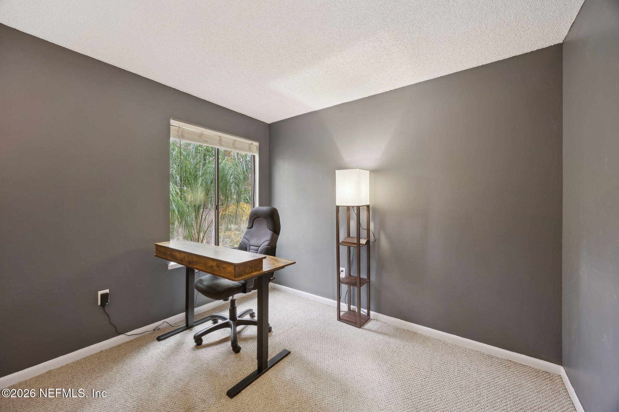 2431 Cypress Springs Road Orange Park, FL 32073 - Photo 44 of 83 a view of a workspace with furniture and a window