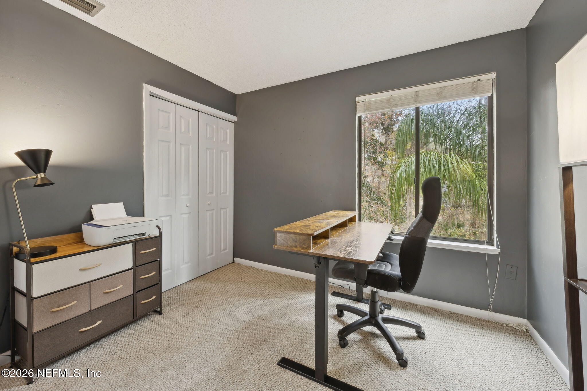 2431 Cypress Springs Road Orange Park, FL 32073 - Photo 45 of 83 a view of a workspace with furniture and a window