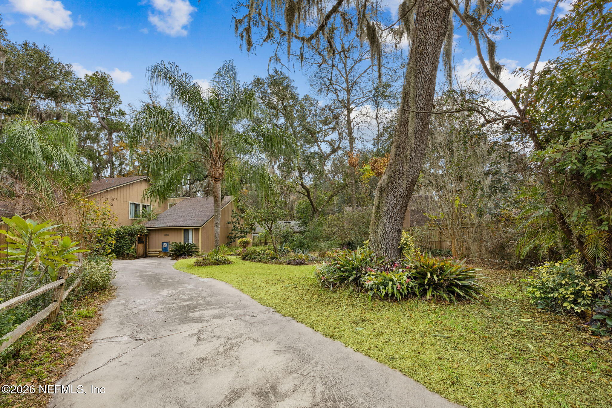 2431 Cypress Springs Road Orange Park, FL 32073 - Photo 8 of 83 a view of a garden with plants and trees