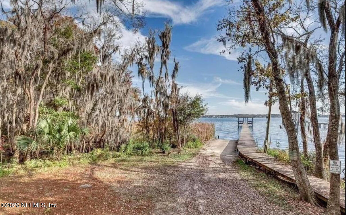 2431 Cypress Springs Road Orange Park, FL 32073 - Photo 81 of 83 a backyard of a house with lots of green space
