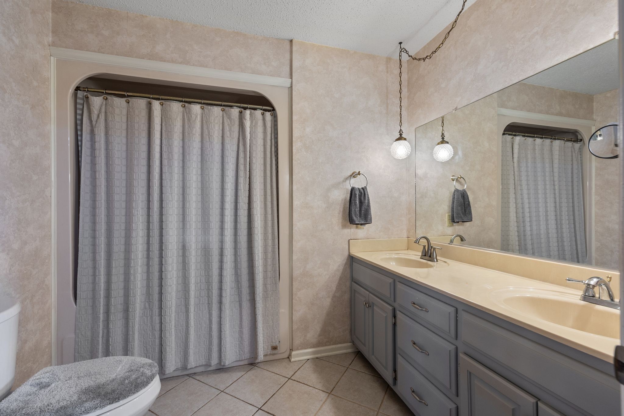 4628 Dugger Road Culleoka, TN 38451 - Photo 20 of 40 a bathroom with a double vanity sink and mirror