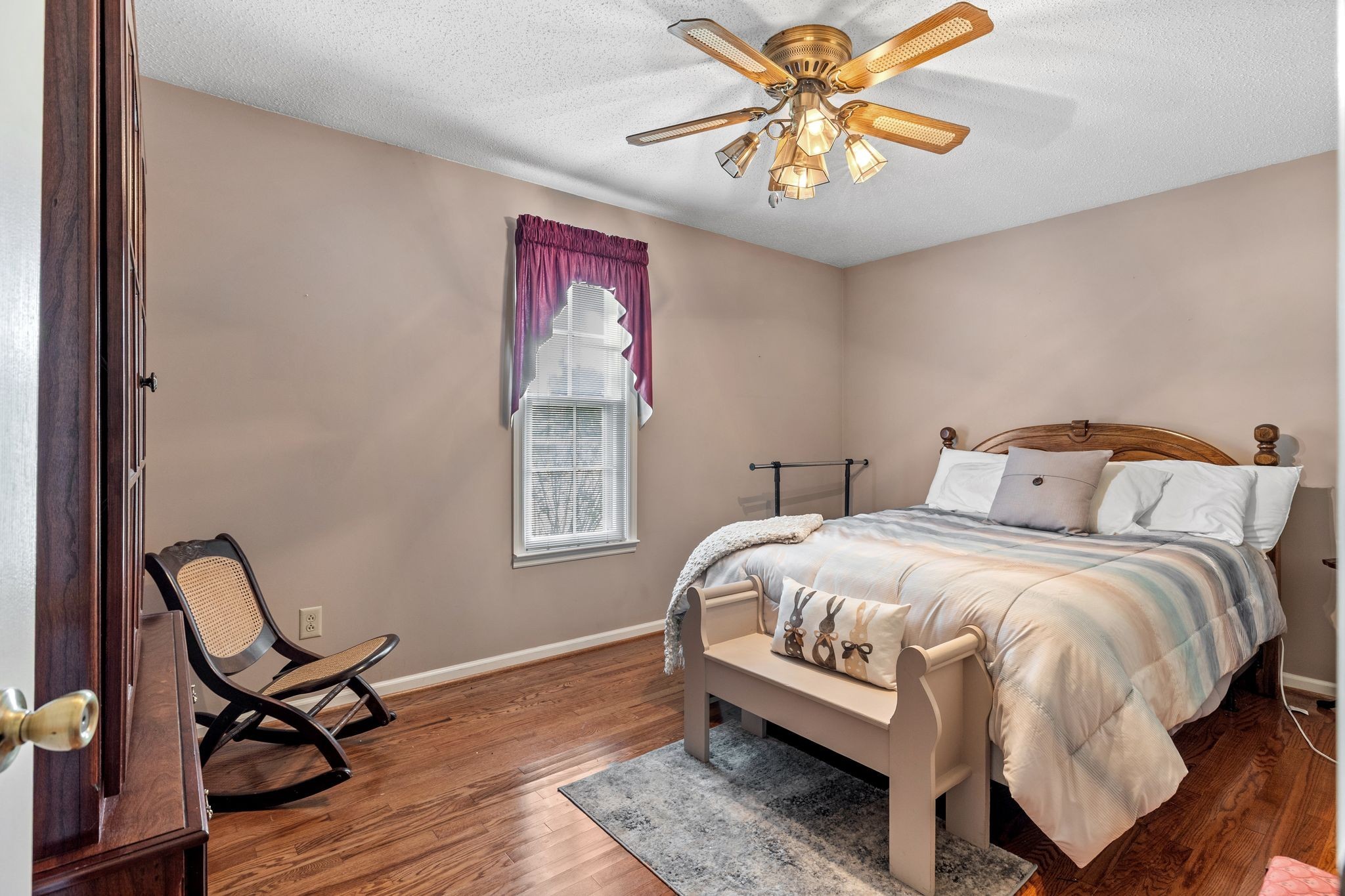 4628 Dugger Road Culleoka, TN 38451 - Photo 22 of 40 a bedroom with a bed and a chandelier