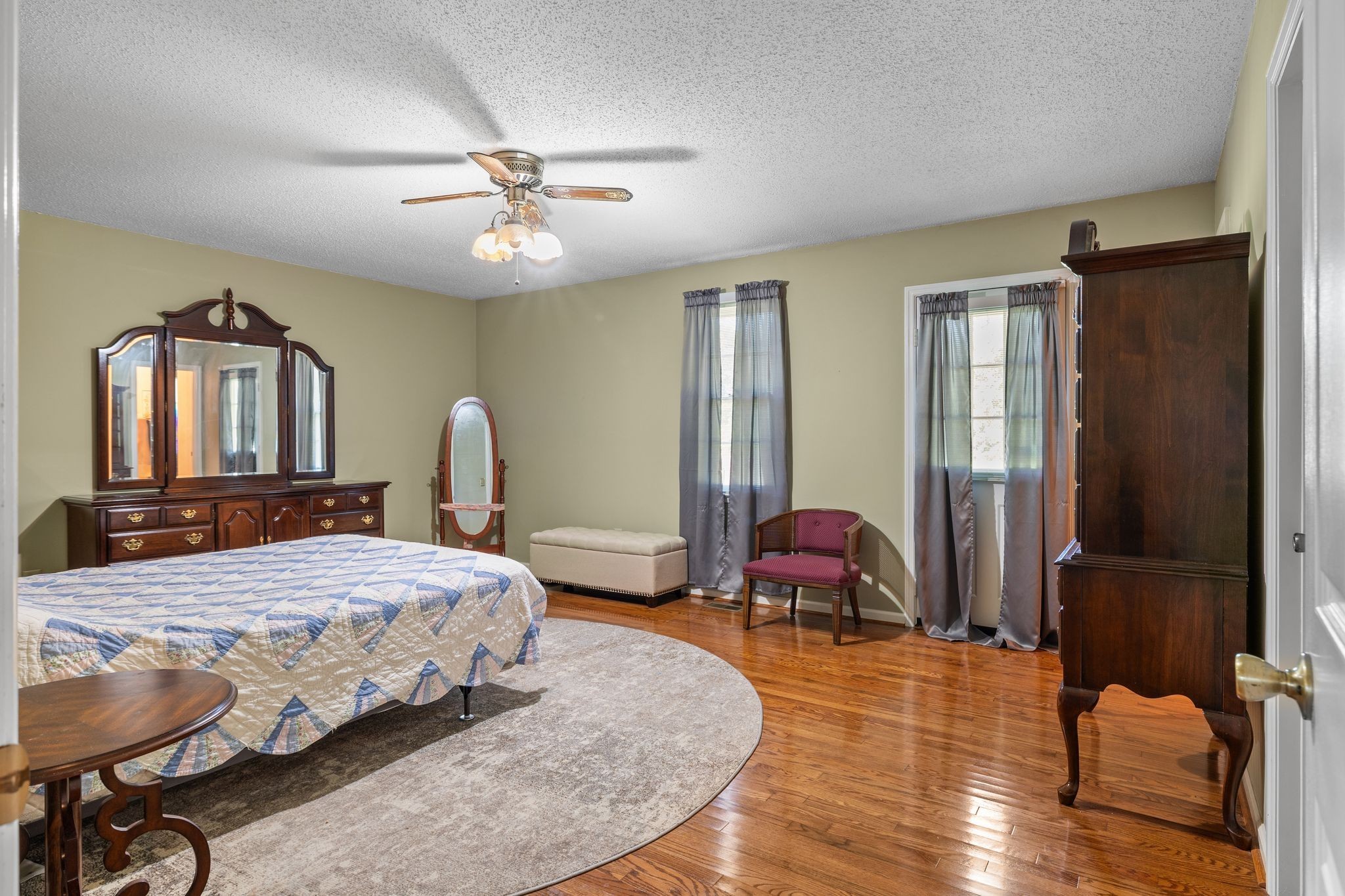 4628 Dugger Road Culleoka, TN 38451 - Photo 23 of 40 a bedroom with a bed dresser and wooden floor