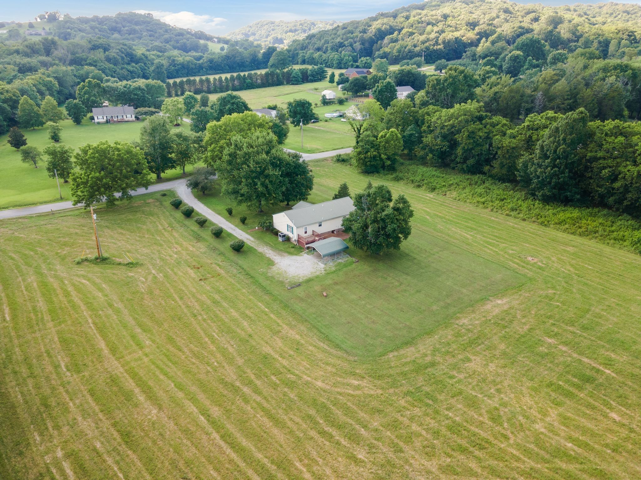 4628 Dugger Road Culleoka, TN 38451 - Photo 40 of 40 a view of a water pond with an outdoor seating