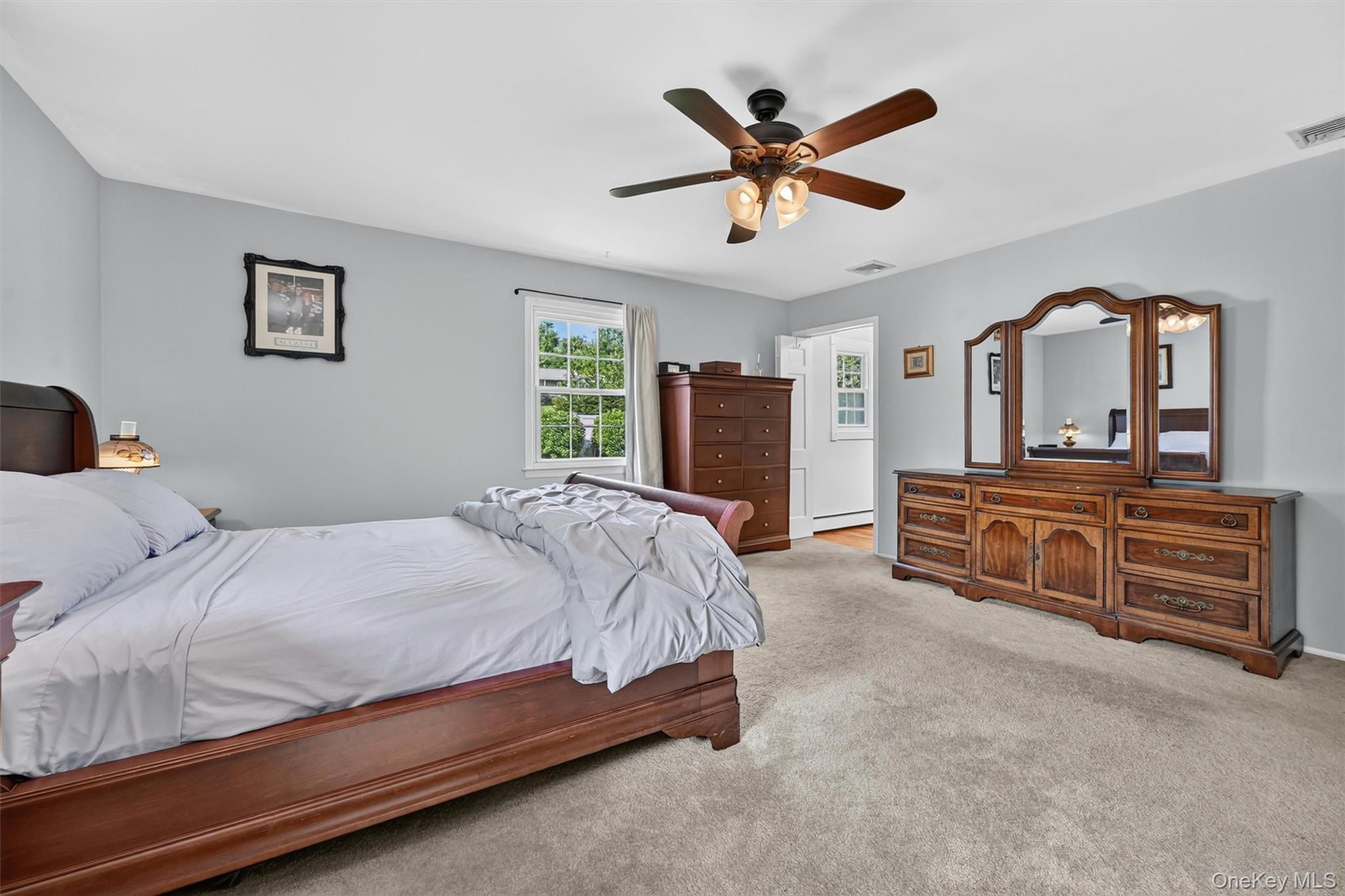 5 Hedges Road Warwick, NY 10990 - Photo 25 of 48 A generous primary suite with neutral tones, multiple windows, and a private en suite bath designed for everyday comfort.