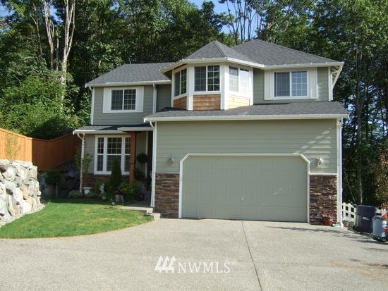 23812 22nd Avenue West Bothell, WA 98021 - Photo 1 of 19 a front view of a house with a garden