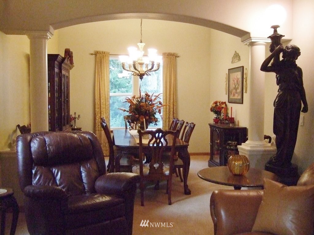 23812 22nd Avenue West Bothell, WA 98021 - Photo 6 of 19 a living room with furniture and a chandelier